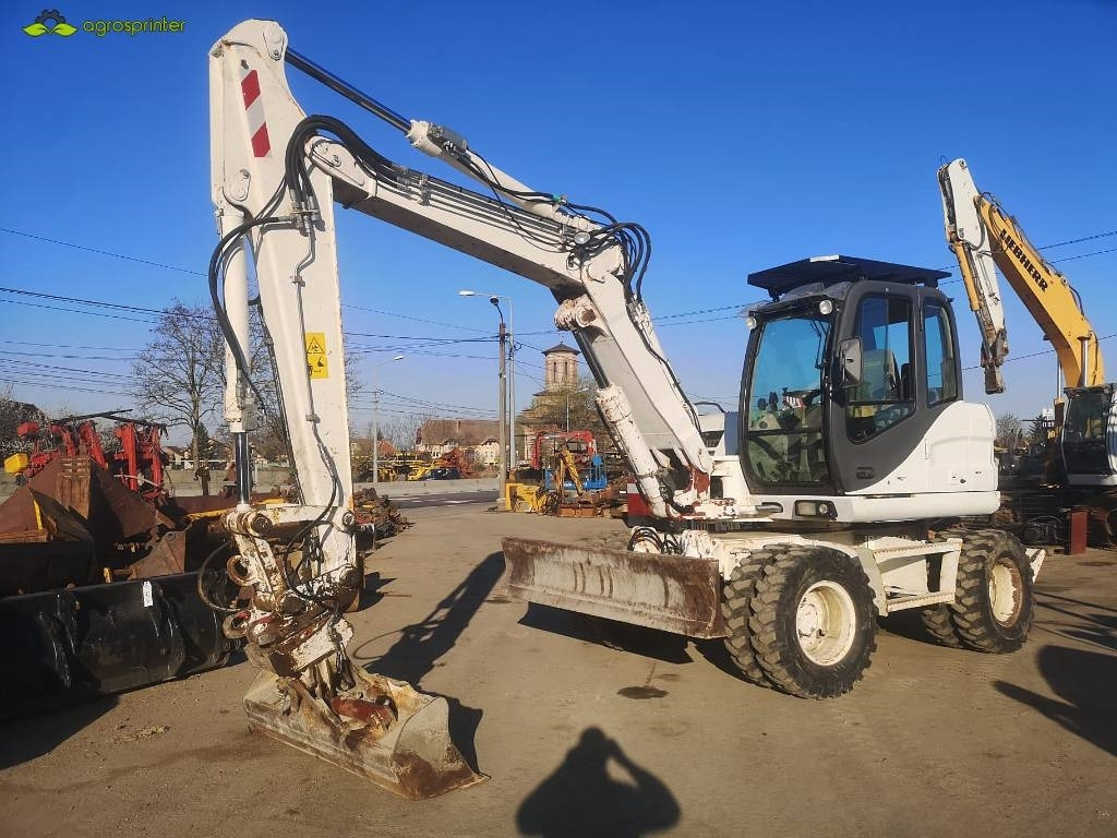 Case WX 125 - Колесен багер: снимка 1 Case WX 125 - Колесен багер: снимка 1