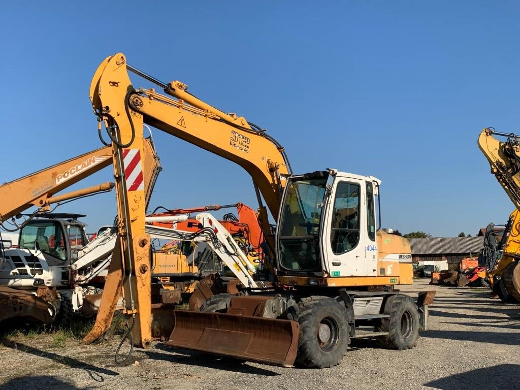 Liebherr A 312 - Колесен багер: снимка 1 Liebherr A 312 - Колесен багер: снимка 1