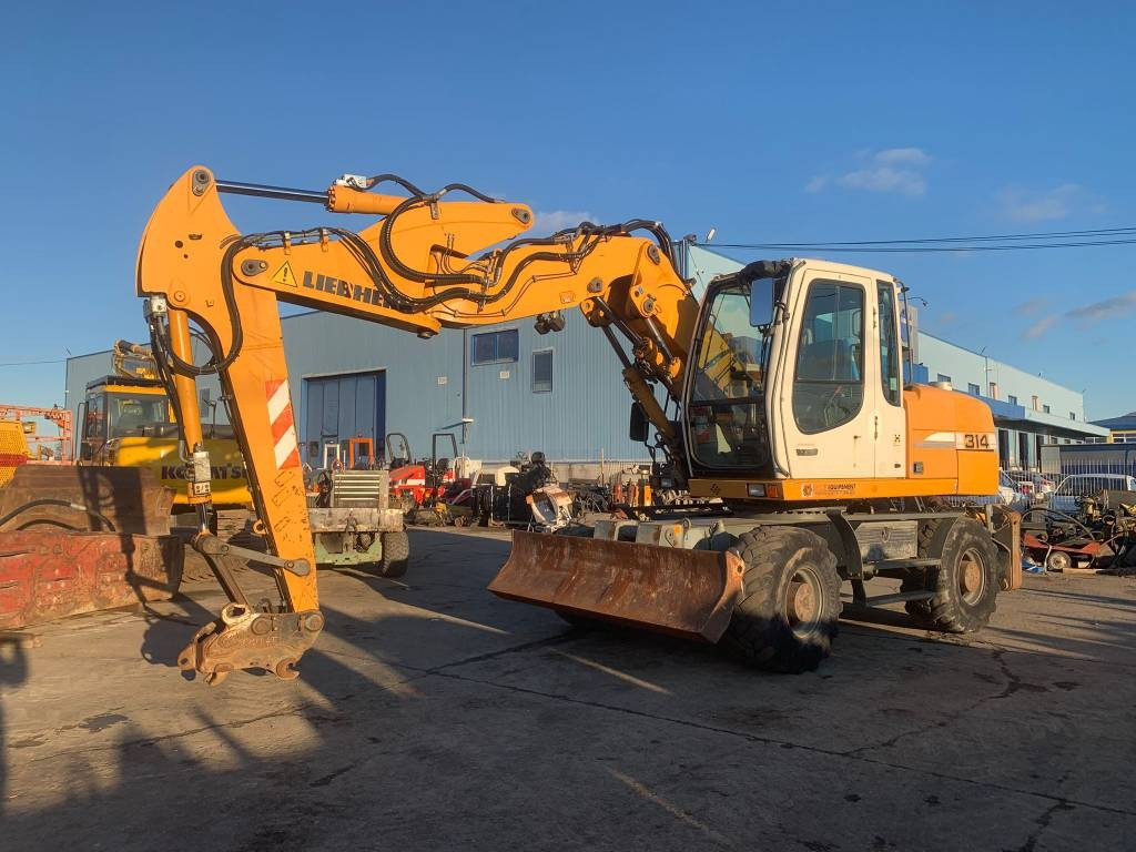 Liebherr A 314 Litronic - Колесен багер: снимка 1 Liebherr A 314 Litronic - Колесен багер: снимка 1