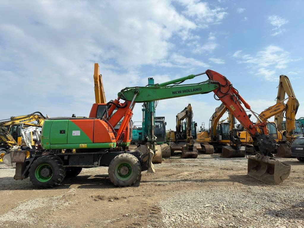New Holland MH Plus - Колесен багер: снимка 2 New Holland MH Plus - Колесен багер: снимка 2