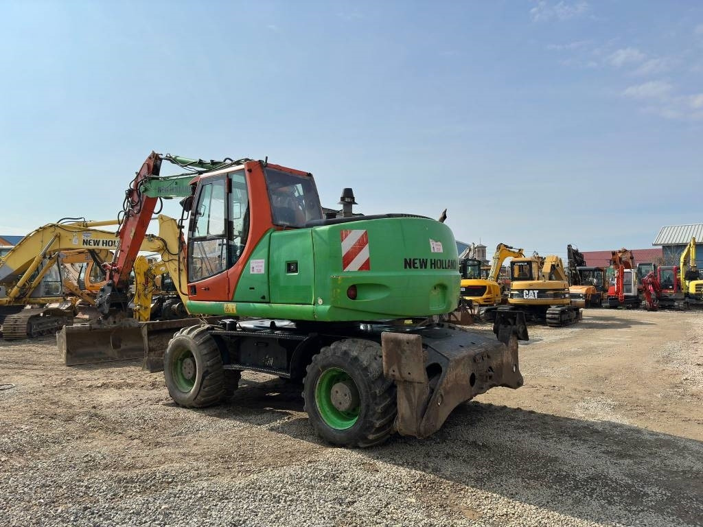New Holland MH Plus - Колесен багер: снимка 5 New Holland MH Plus - Колесен багер: снимка 5