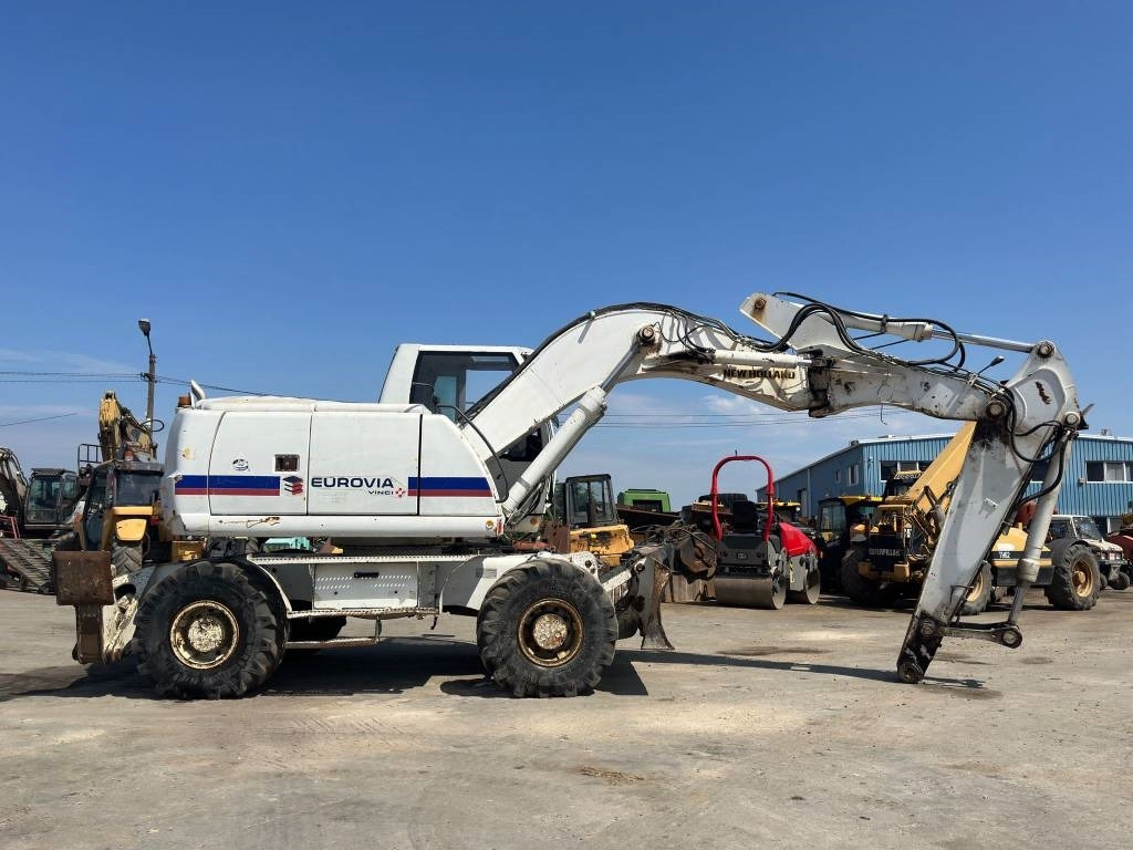 New Holland MH Plus - Колесен багер: снимка 3 New Holland MH Plus - Колесен багер: снимка 3