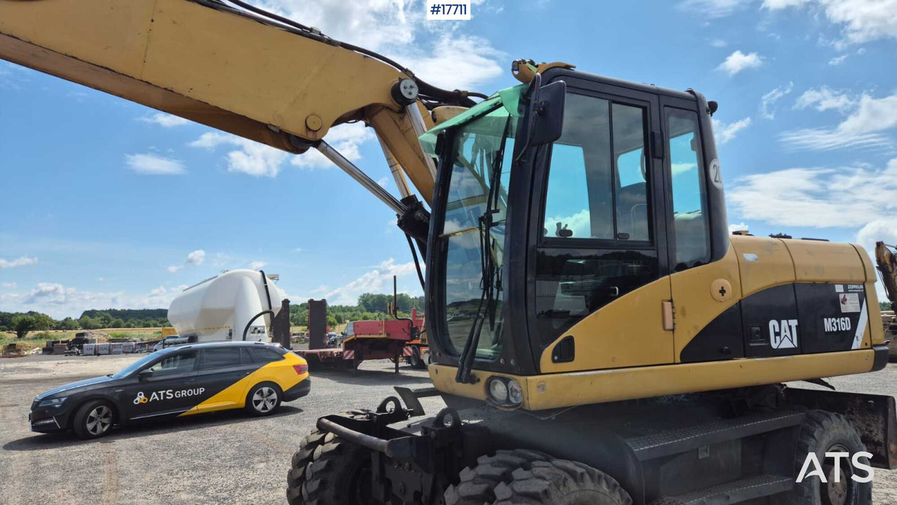 Колесен багер 2008 CAT M316D: снимка 16