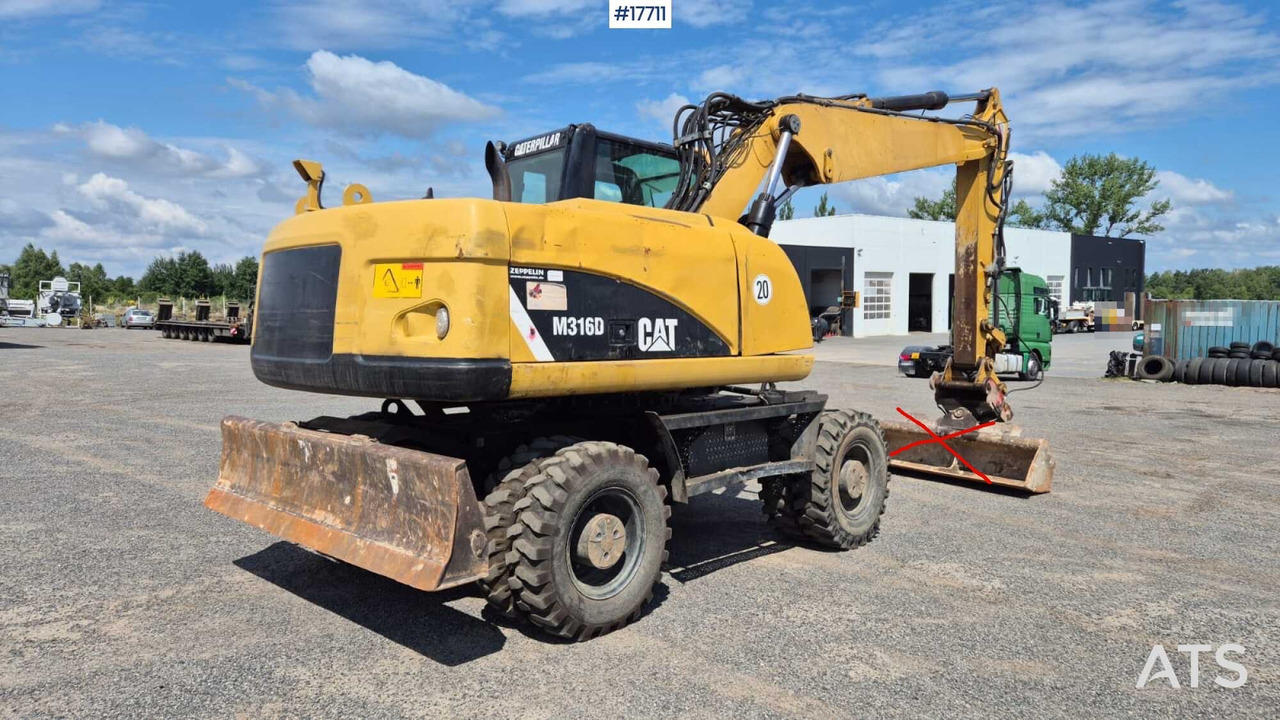 Колесен багер 2008 CAT M316D: снимка 10