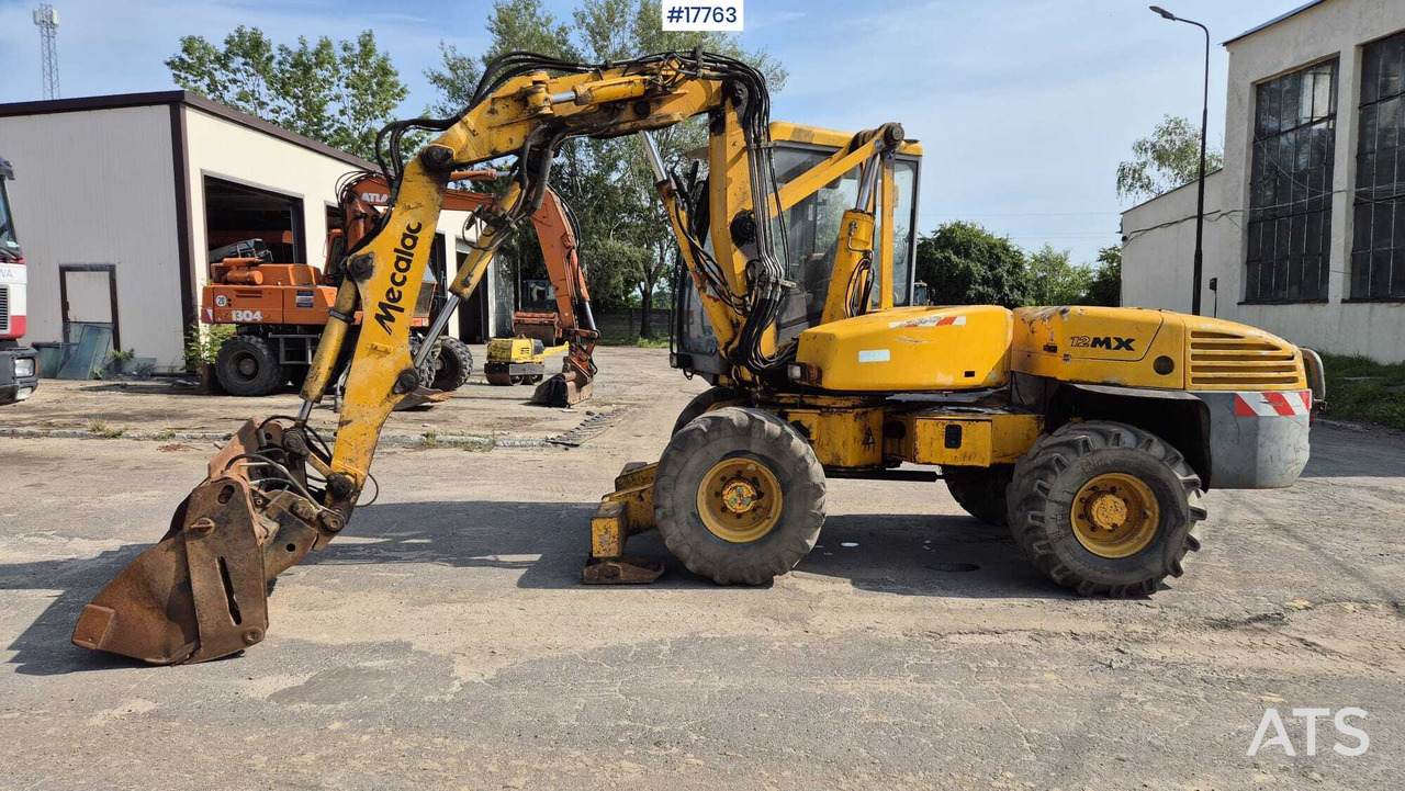 MECALAC 12MX wheeled excavator (1996) - Колесен багер: снимка 5 MECALAC 12MX wheeled excavator (1996) - Колесен багер: снимка 5