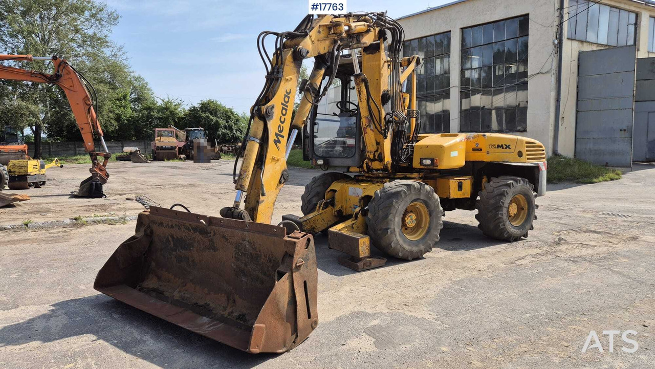 MECALAC 12MX wheeled excavator (1996) - Колесен багер: снимка 1 MECALAC 12MX wheeled excavator (1996) - Колесен багер: снимка 1