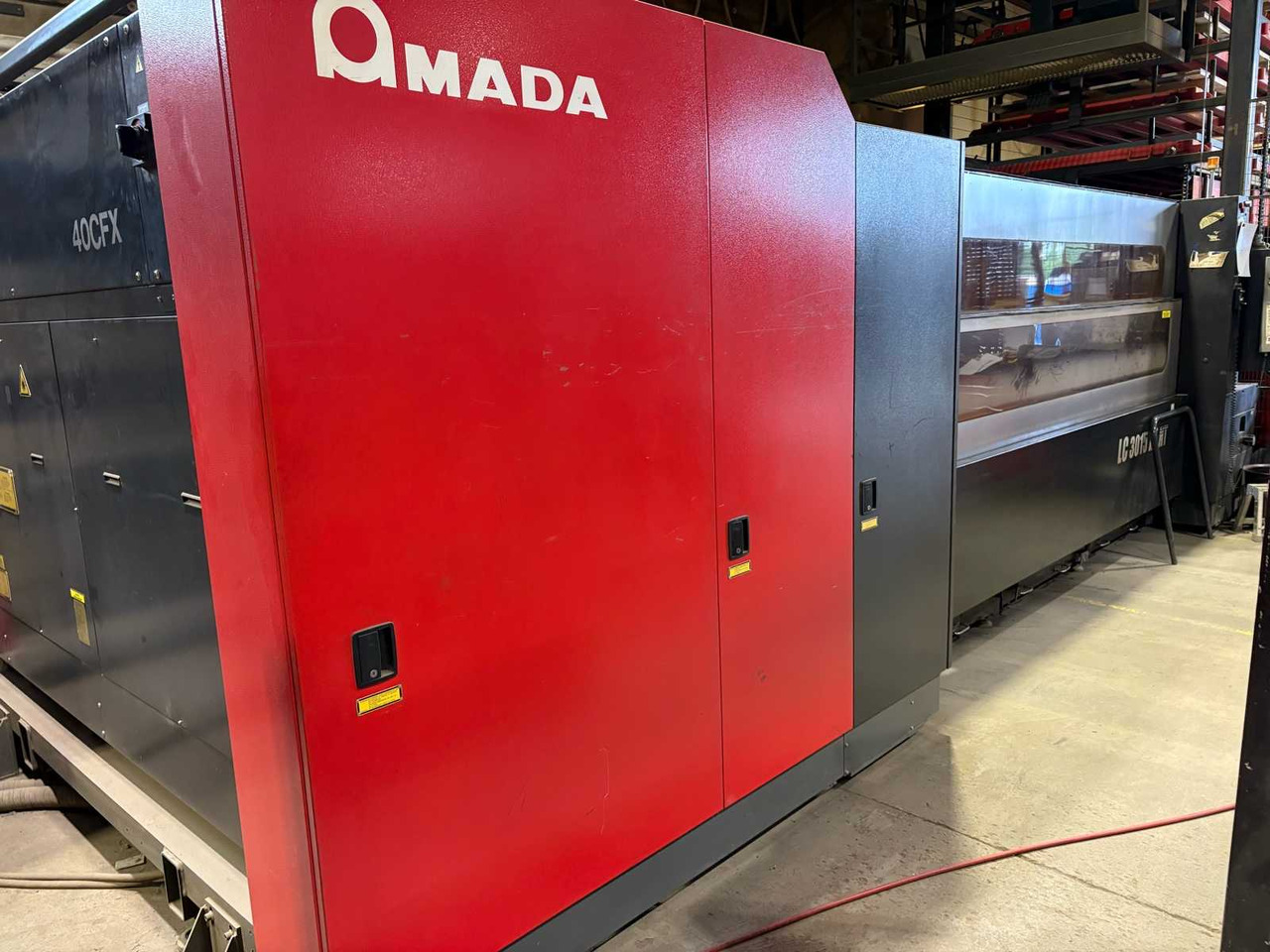 CNC Controlled CO2 Laser Cutting Machine Amada LC 3015 X1 NT - Металообработваща машина: снимка 2 CNC Controlled CO2 Laser Cutting Machine Amada LC 3015 X1 NT - Металообработваща машина: снимка 2