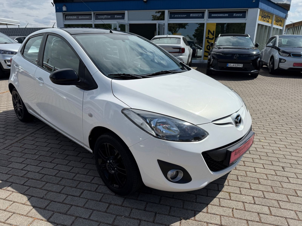 Mazda 2 Lim. 1.3 Origami 5 TÜER KLIMA SHZ TÜV NEU - Лек автомобил: снимка 2 Mazda 2 Lim. 1.3 Origami 5 TÜER KLIMA SHZ TÜV NEU - Лек автомобил: снимка 2