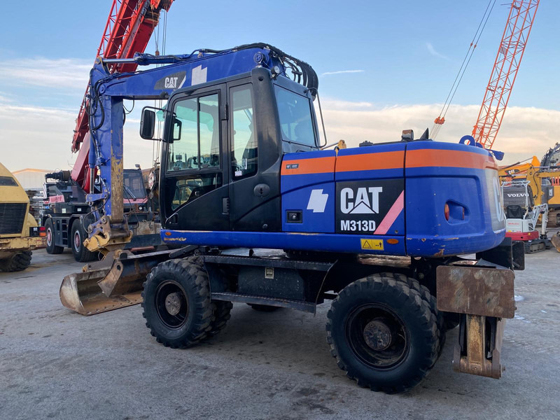 Caterpillar M313D NVT - Багер: снимка 1 Caterpillar M313D NVT - Багер: снимка 1