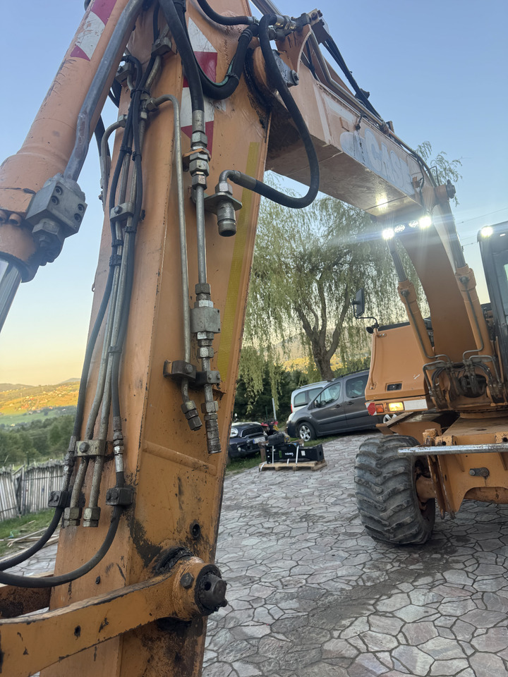 Колесен багер Case WX145: снимка 11