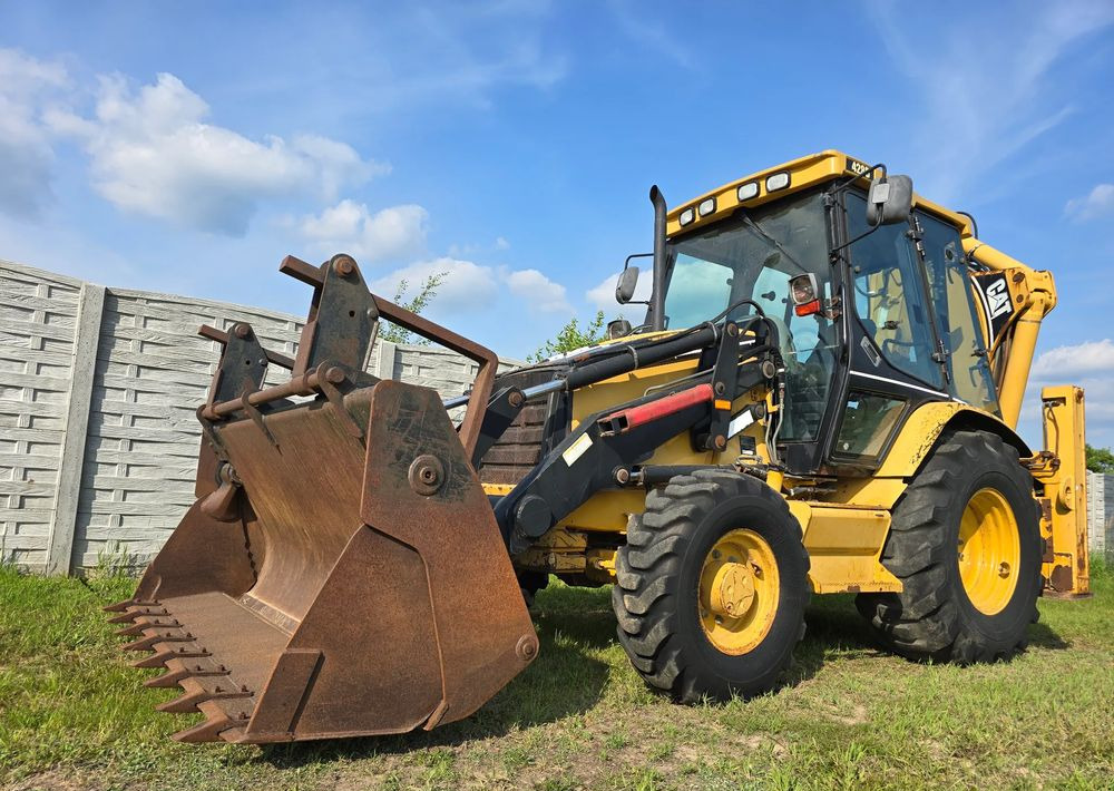 Caterpillar - Багер-товарач: снимка 1 Caterpillar - Багер-товарач: снимка 1