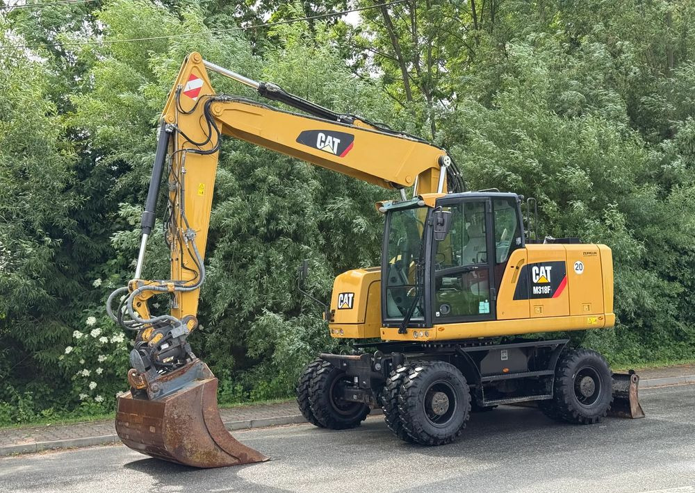 Caterpillar CAT 318 F * Powertilt * Sprowadzony* 9700 MTG * Caterpillar * Stan Perfekcyjny - Колесен багер: снимка 1 Caterpillar CAT 318 F * Powertilt * Sprowadzony* 9700 MTG * Caterpillar * Stan Perfekcyjny - Колесен багер: снимка 1