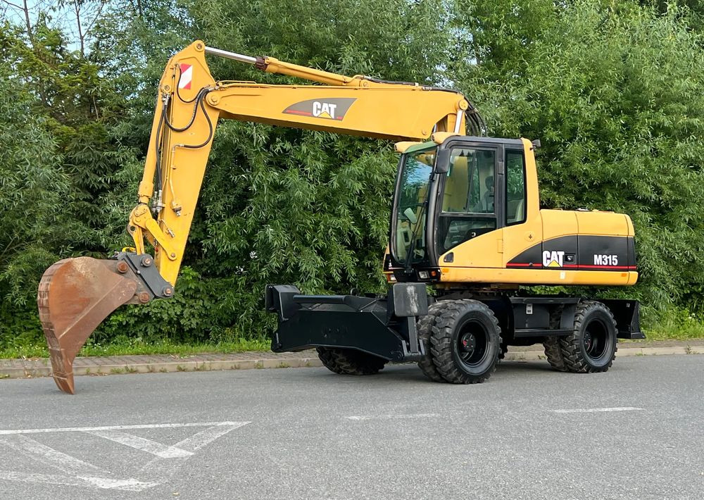 Caterpillar CAT M315C CATERPILLAR SPROWADZONY Bardzo Dobry Stan - Колесен багер: снимка 1 Caterpillar CAT M315C CATERPILLAR SPROWADZONY Bardzo Dobry Stan - Колесен багер: снимка 1