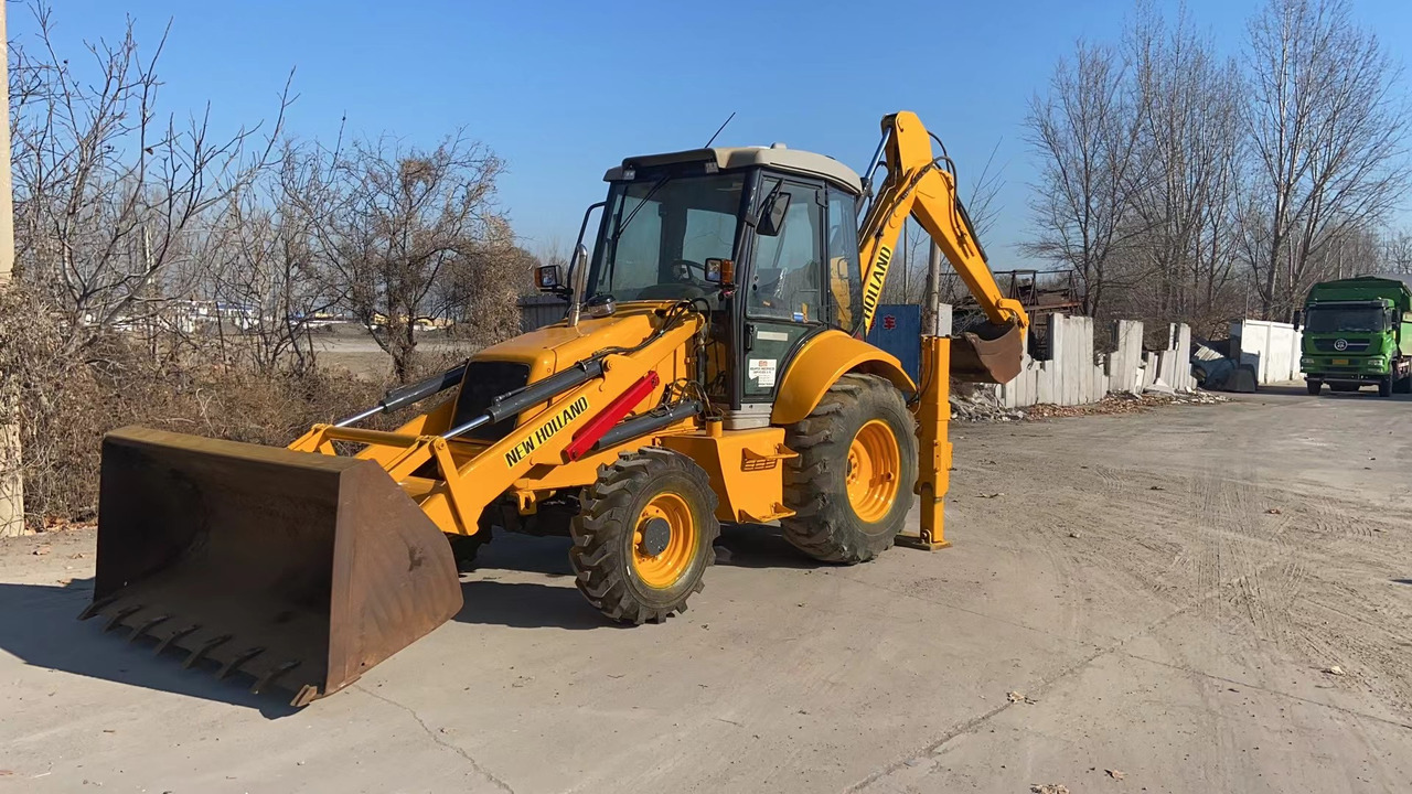 NEW HOLLAND LB95 - Багер-товарач: снимка 1 NEW HOLLAND LB95 - Багер-товарач: снимка 1