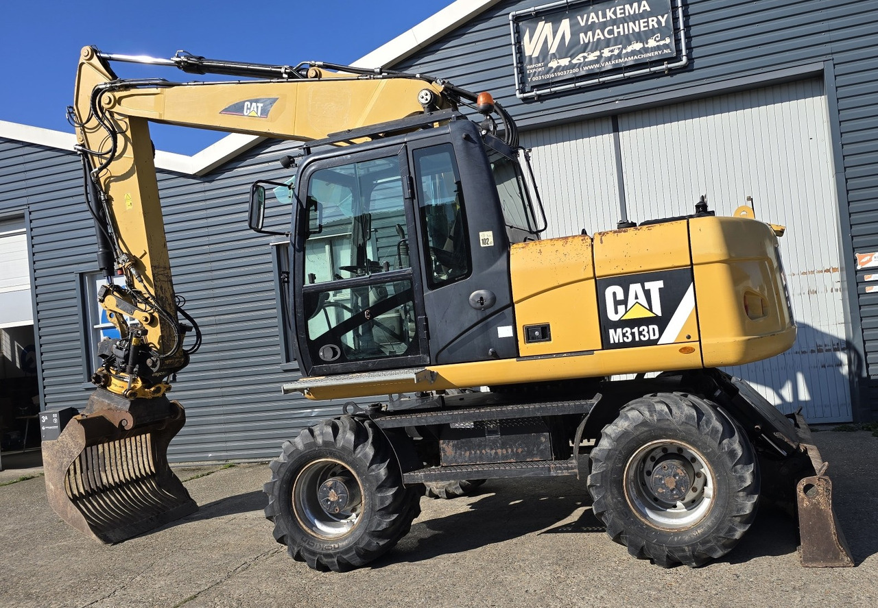 Колесен багер CATERPILLAR M313D: снимка 8