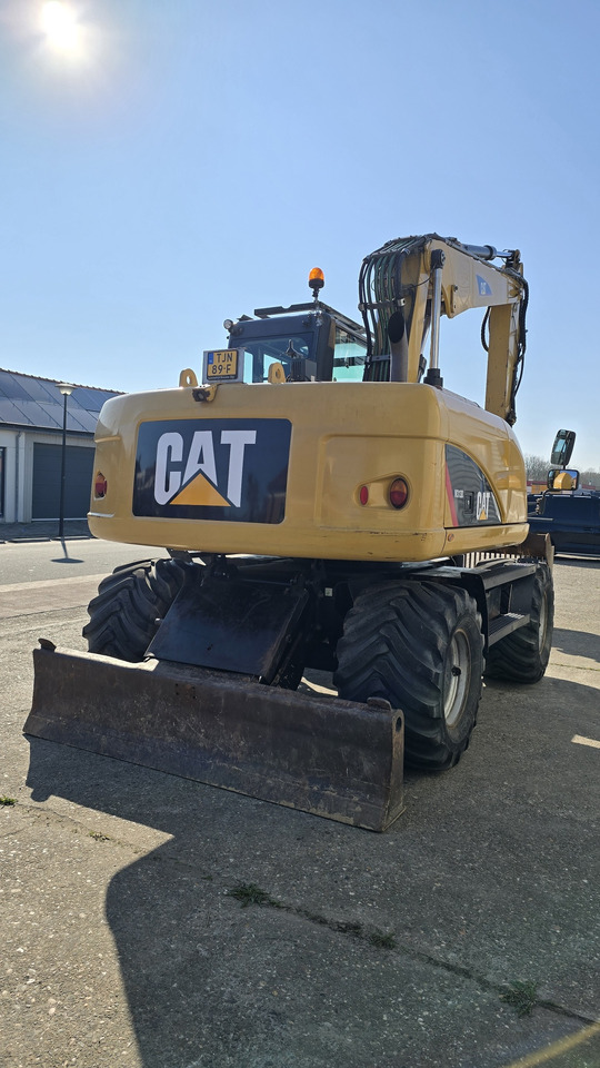 Колесен багер CATERPILLAR M313D: снимка 6
