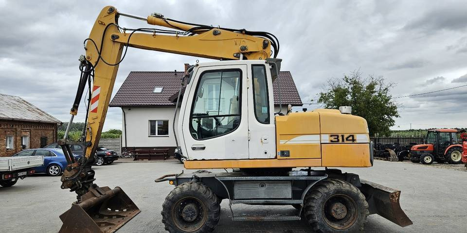 Koparka kołowa Liebherr A314 Litronic 9350 h 4 łyżki kołówka - Колесен багер: снимка 1 Koparka kołowa Liebherr A314 Litronic 9350 h 4 łyżki kołówka - Колесен багер: снимка 1