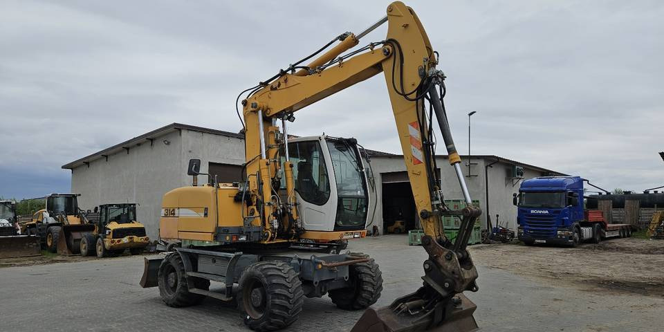 Koparka kołowa Liebherr A314 Litronic 9350 h+ 5 łyżek kołówka - Колесен багер: снимка 4 Koparka kołowa Liebherr A314 Litronic 9350 h+ 5 łyżek kołówka - Колесен багер: снимка 4