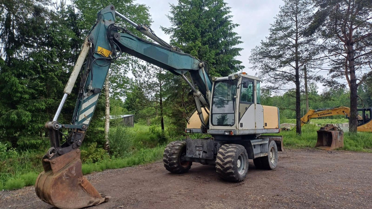 Volvo EW140 - Колесен багер: снимка 1 Volvo EW140 - Колесен багер: снимка 1