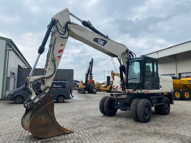 Cat M 318 D VAH (12005443) - Колесен багер: снимка 1 Cat M 318 D VAH (12005443) - Колесен багер: снимка 1