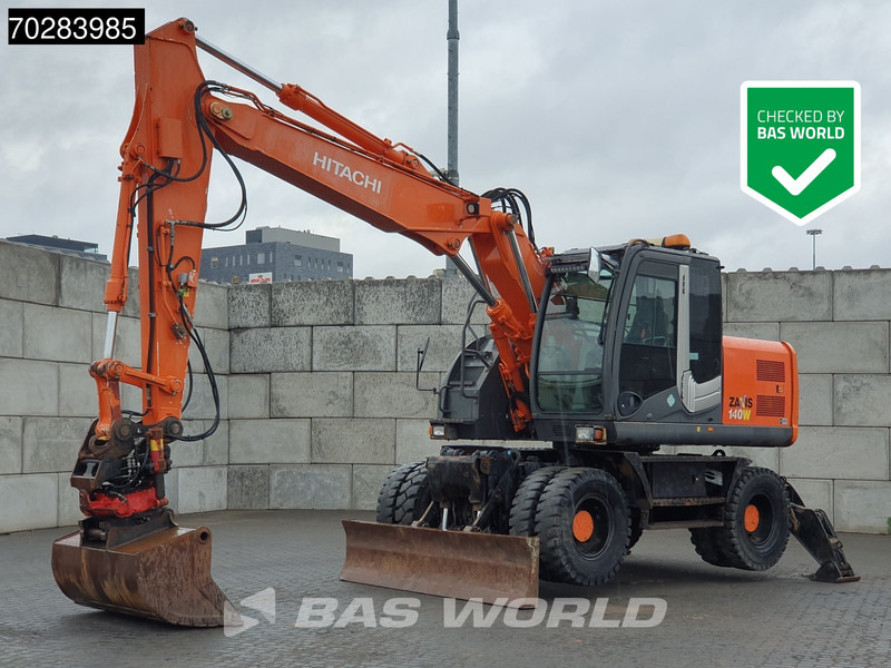 Hitachi ZX140W -3 OUTRIGGERS - ROTOTILT - Колесен багер: снимка 1 Hitachi ZX140W -3 OUTRIGGERS - ROTOTILT - Колесен багер: снимка 1