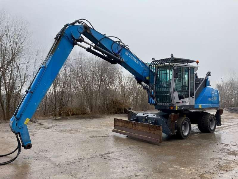 Fuchs MHL 320 - Багер за манипулиране на материали: снимка 1 Fuchs MHL 320 - Багер за манипулиране на материали: снимка 1