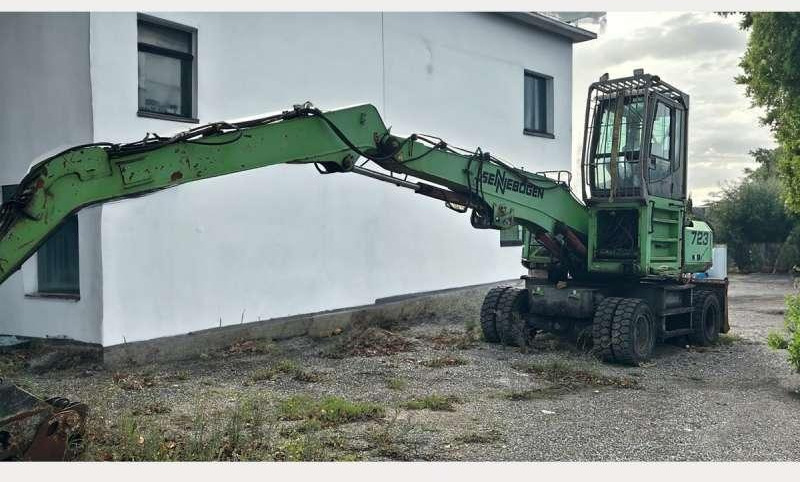 Sennebogen 723 - Багер за манипулиране на материали: снимка 1 Sennebogen 723 - Багер за манипулиране на материали: снимка 1