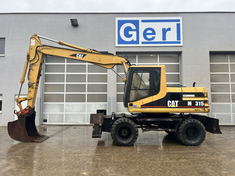 Caterpillar M 315 (111063) - Колесен багер: снимка 1 Caterpillar M 315 (111063) - Колесен багер: снимка 1