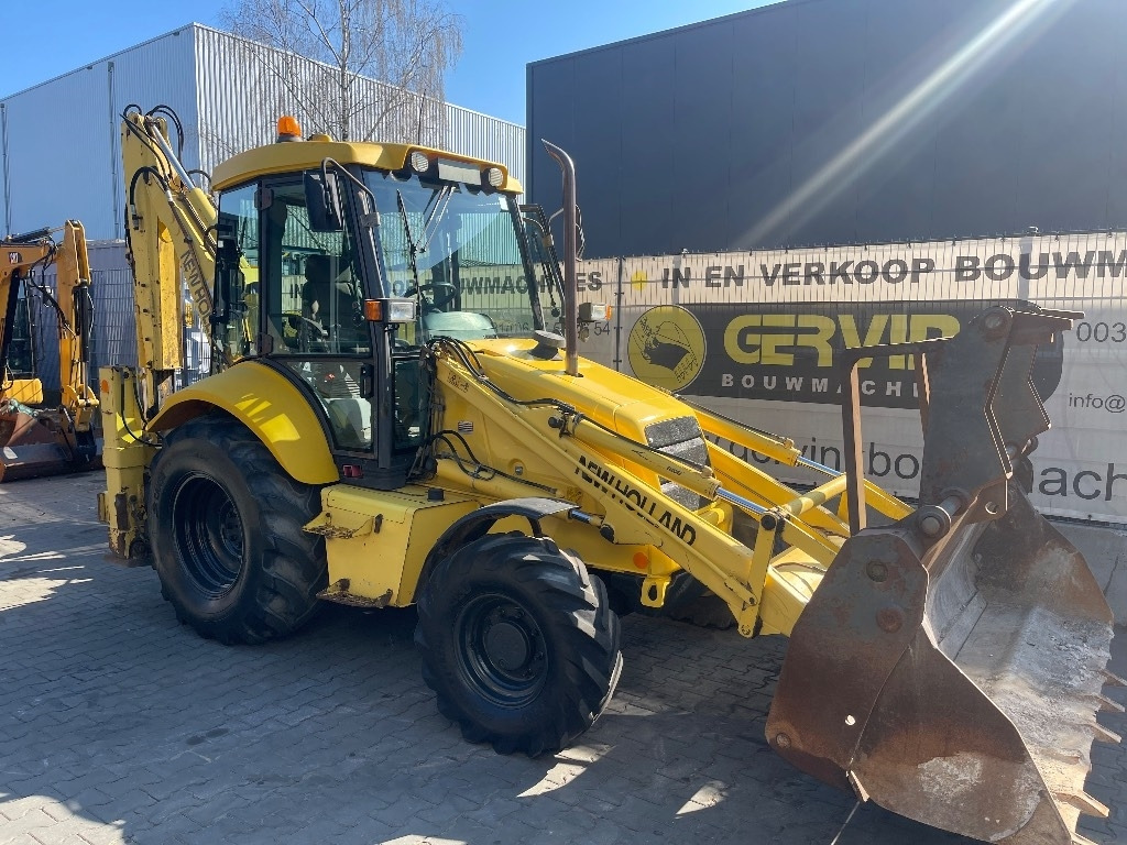 New Holland LB 110 - Багер-товарач: снимка 1 New Holland LB 110 - Багер-товарач: снимка 1