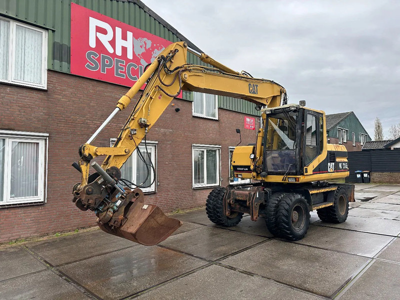 Caterpillar M315 +ROTO CE - Колесен багер: снимка 2 Caterpillar M315 +ROTO CE - Колесен багер: снимка 2