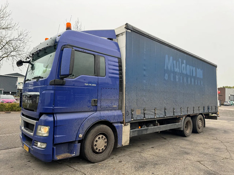 MAN TGX 26.400 6X2 - EURO 4 + LIFT + STEERING AXLE + TÜV 10-2025 - Камион с брезент: снимка 1 MAN TGX 26.400 6X2 - EURO 4 + LIFT + STEERING AXLE + TÜV 10-2025 - Камион с брезент: снимка 1