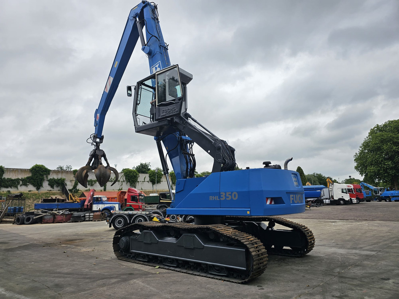 Fuchs RHL 350 Materialhandler With Adjustable Tracks - Багер за манипулиране на материали: снимка 4 Fuchs RHL 350 Materialhandler With Adjustable Tracks - Багер за манипулиране на материали: снимка 4