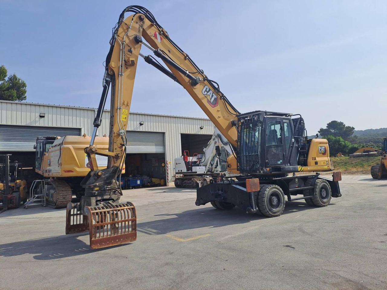 CAT MH3024 - Колесен багер: снимка 1 CAT MH3024 - Колесен багер: снимка 1