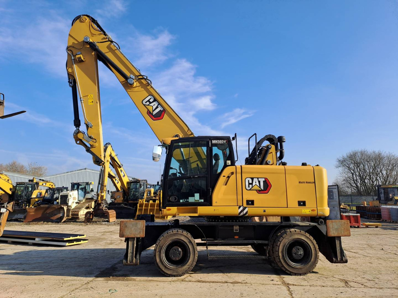 CAT MH3024 - Колесен багер: снимка 1 CAT MH3024 - Колесен багер: снимка 1