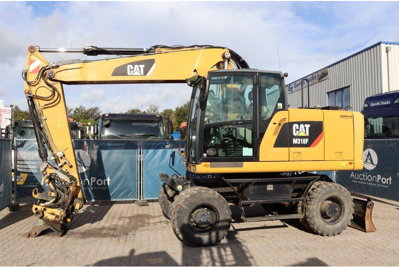 Caterpillar M318F - Колесен багер: снимка 1 Caterpillar M318F - Колесен багер: снимка 1