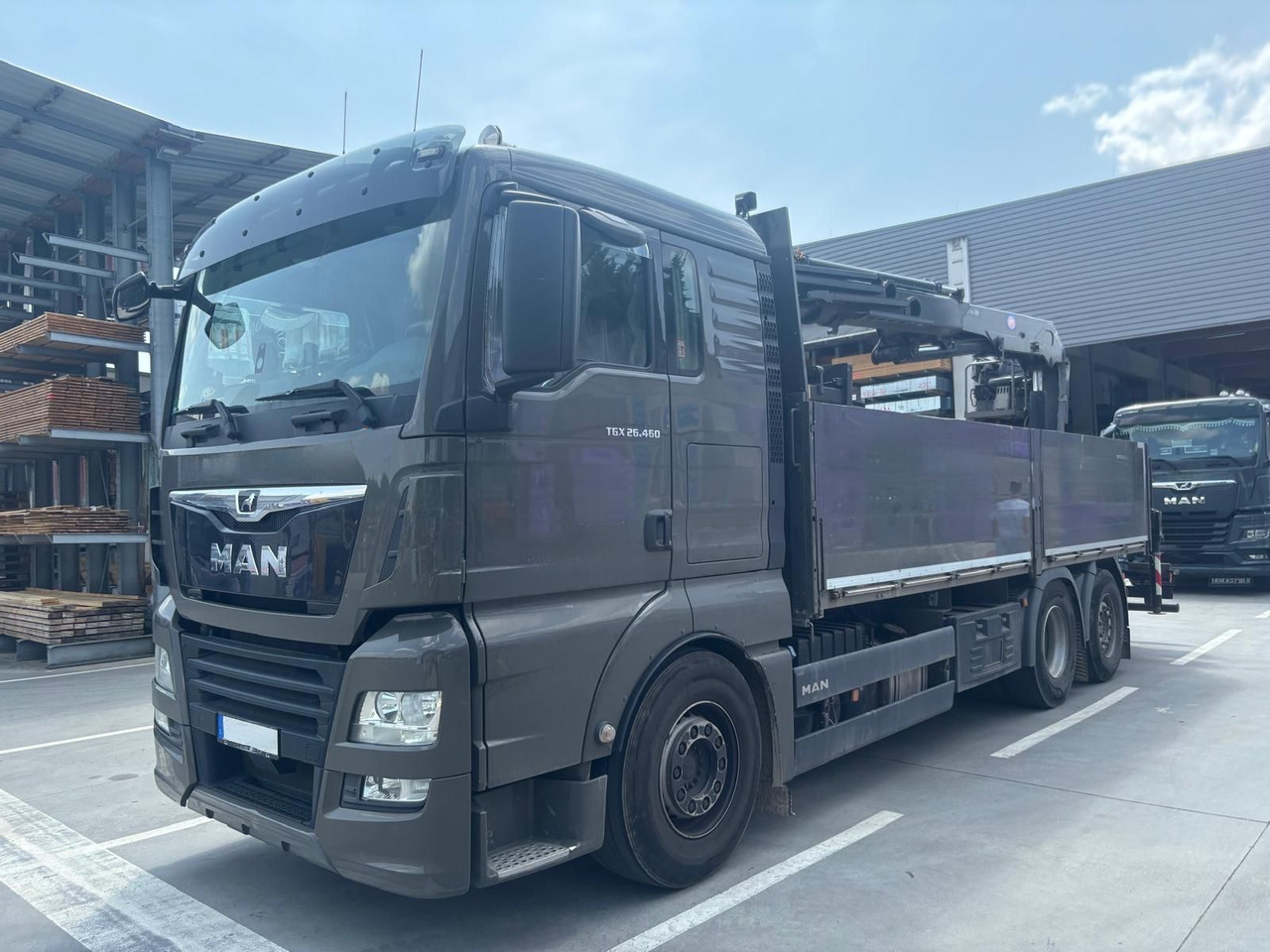 MAN 26.460 TGX Baustoffkran HMF 2110-L3 - Камион с кран: снимка 1 MAN 26.460 TGX Baustoffkran HMF 2110-L3 - Камион с кран: снимка 1